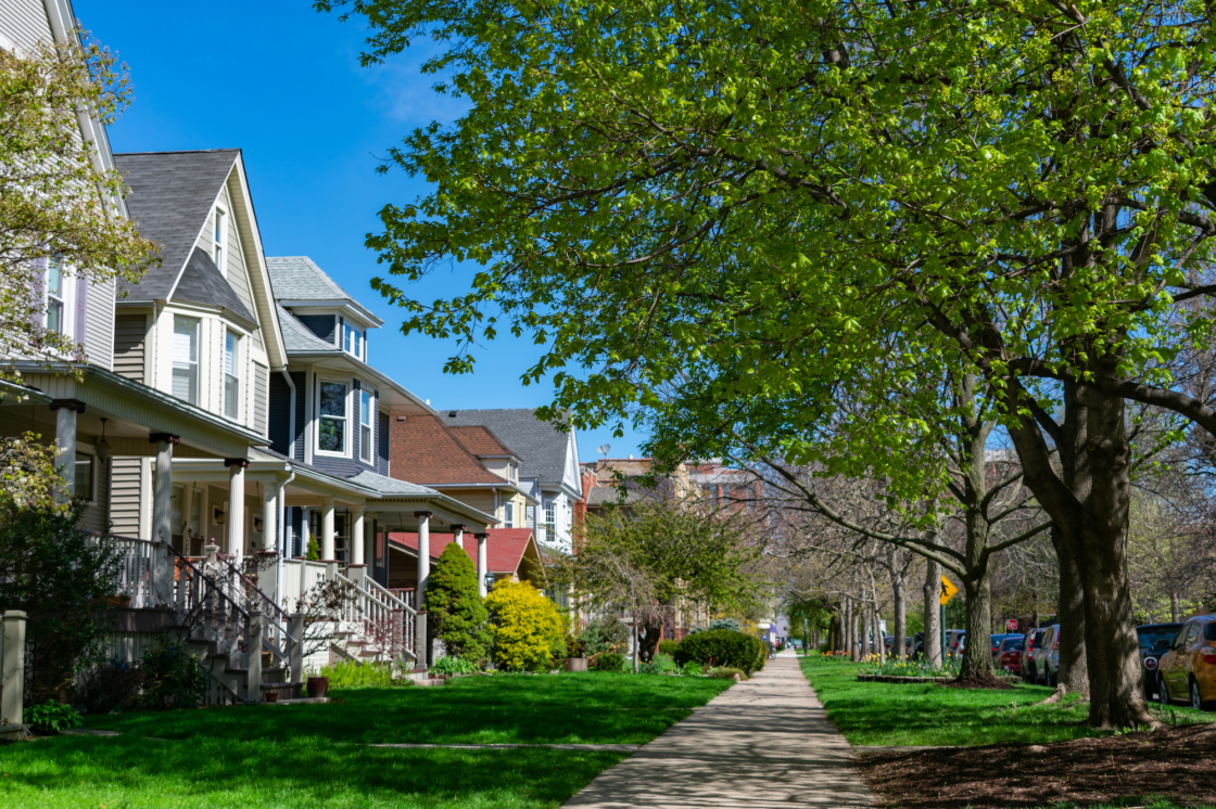 Sidewalk with homes and street trees