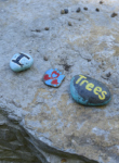 Closeup of painted rocks at the word garden